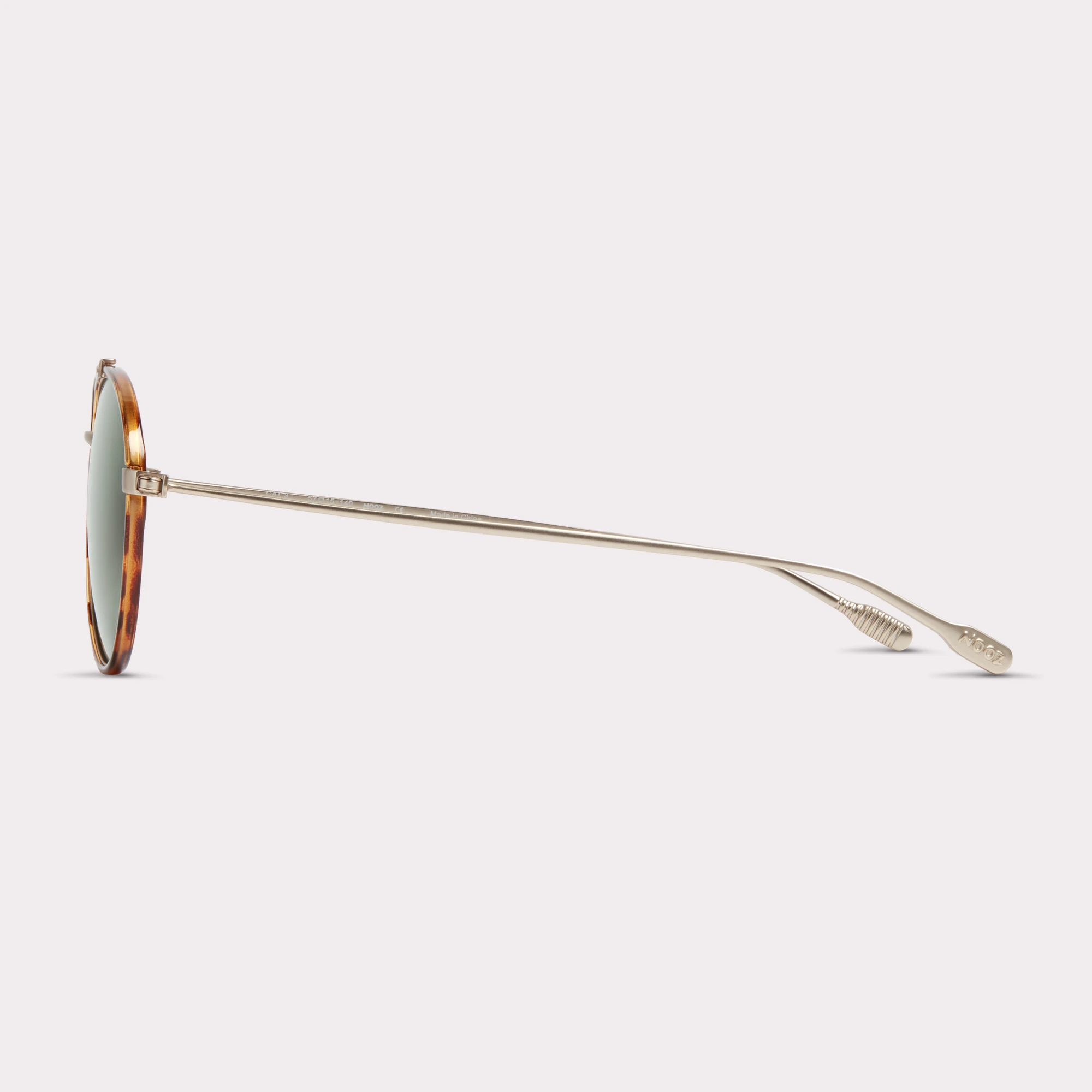 A pair of Jet Tortoise Sunglasses  seen from the side