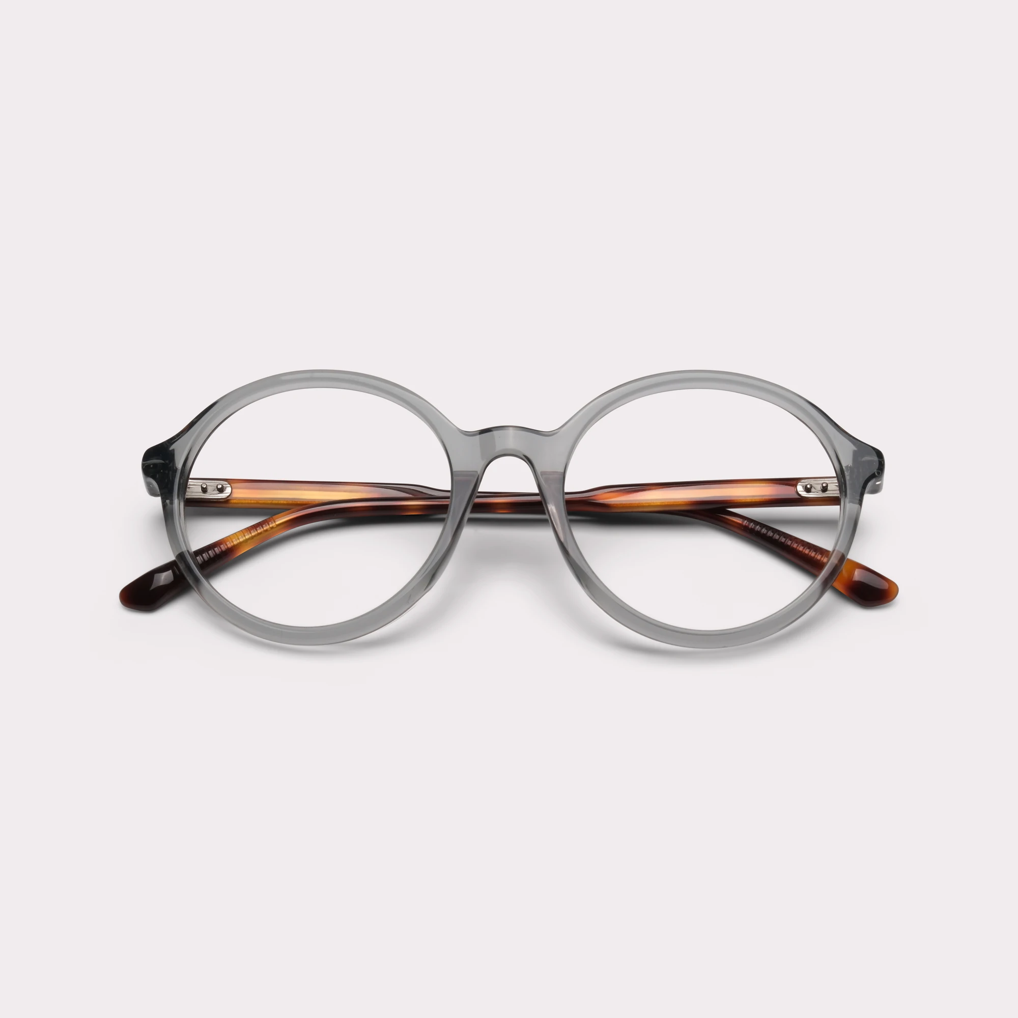 Um par de Sol Grey Green Óculos graduados dobrado