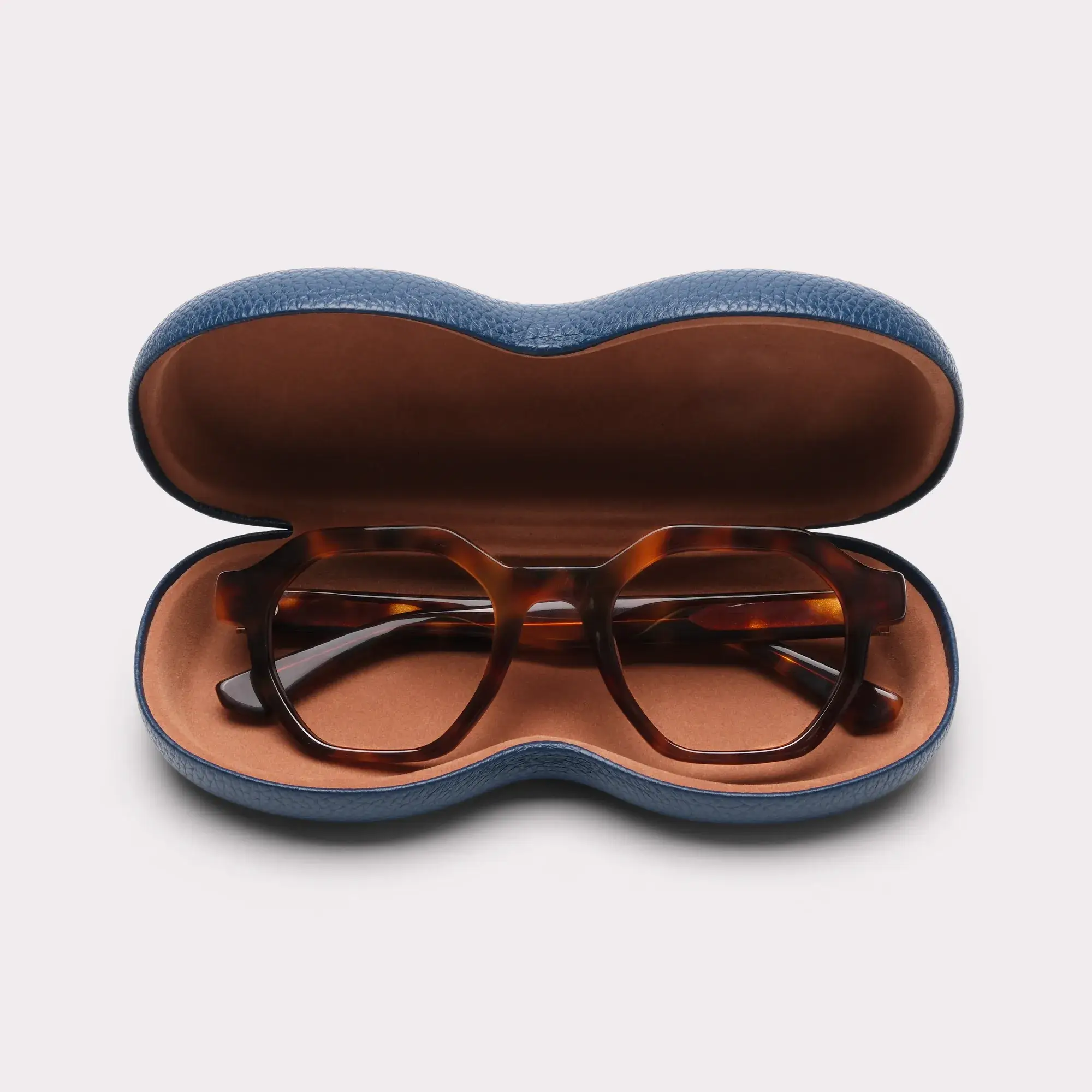 A pair of Miller Tortoise Reading glasses coming out of its case