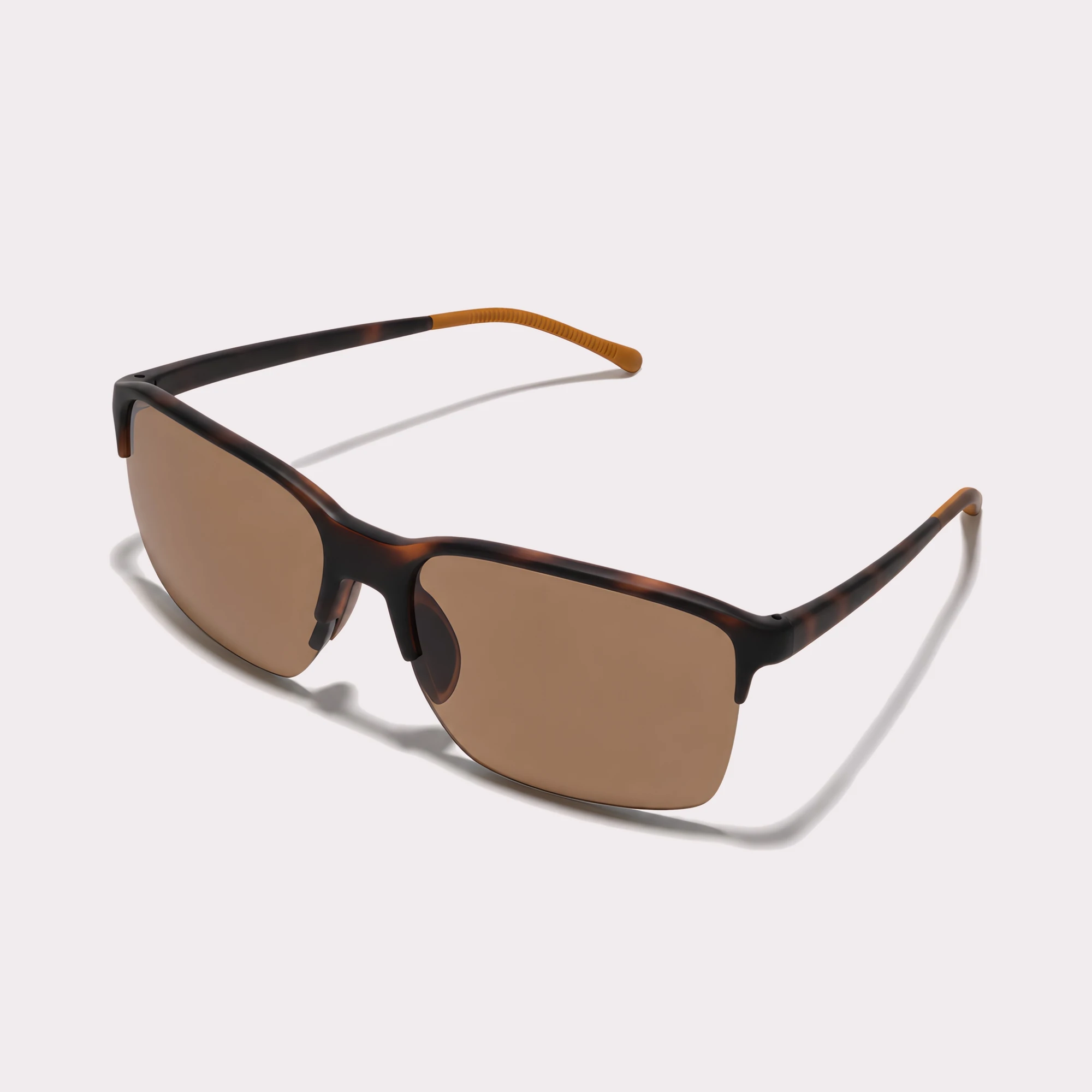 A pair of Peak Tortoise Sunglasses seen from the side