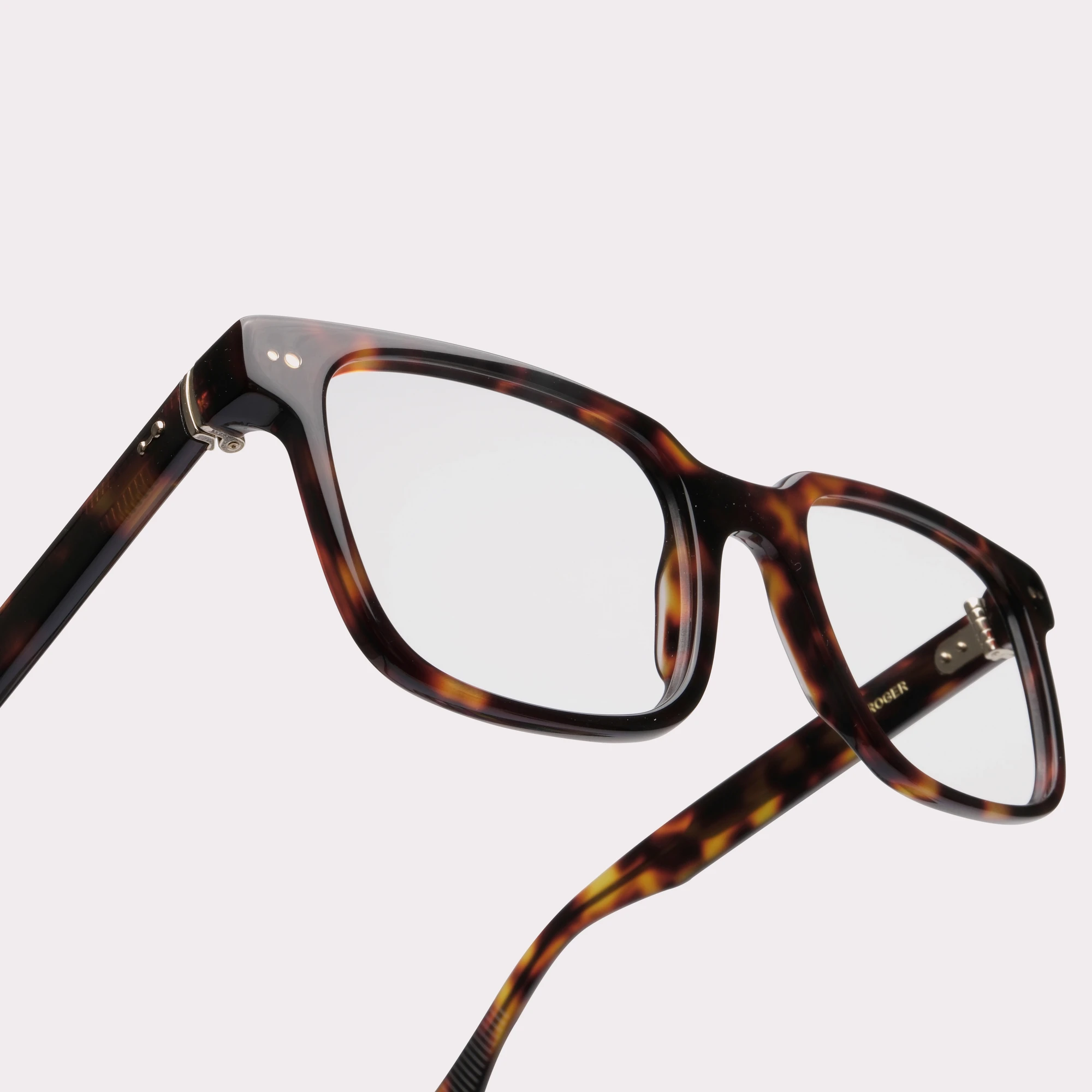 A pair of Roger Tortoise Prescription glasses in a macro view
