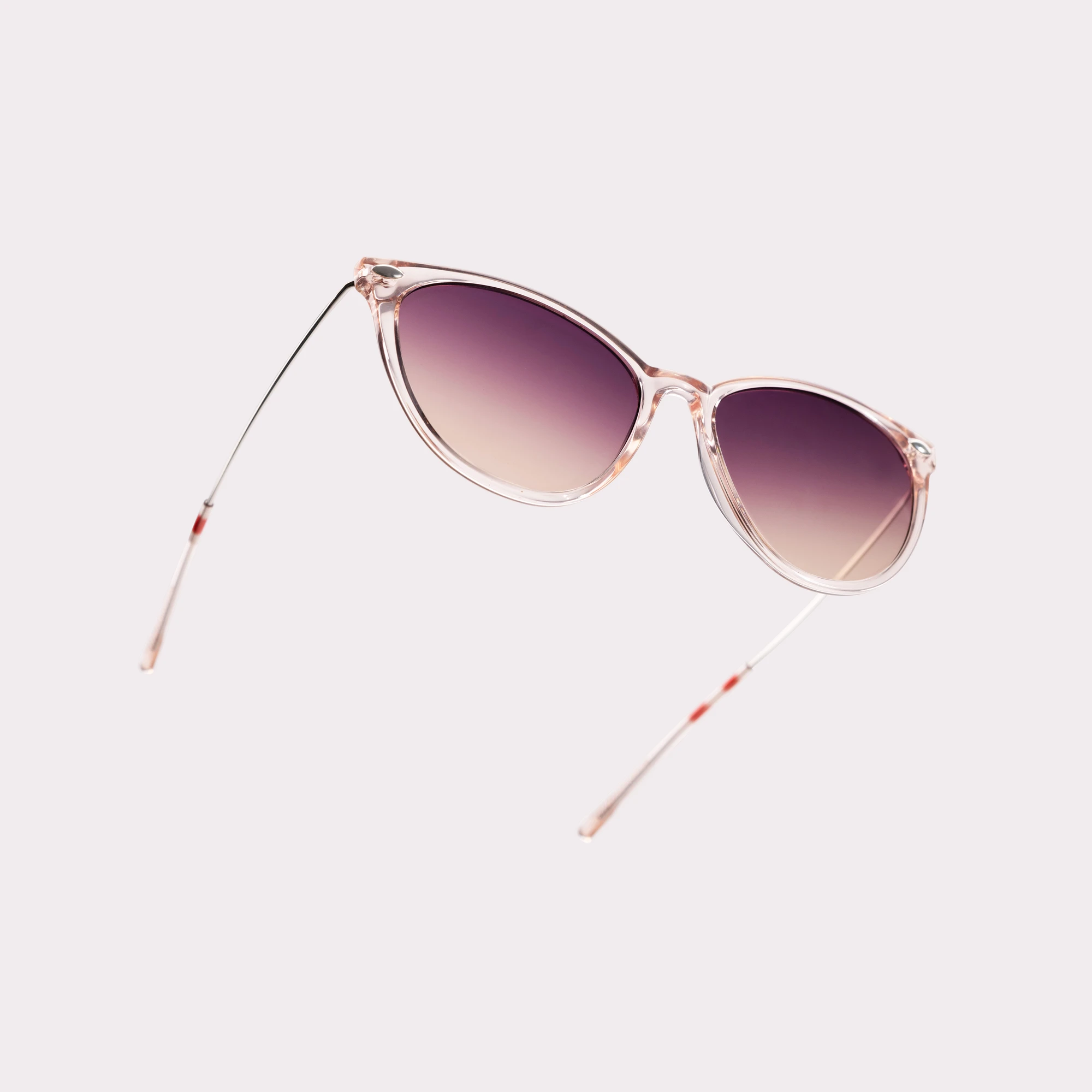 A pair of Ivy Demi-Red Sunglasses in a macro view