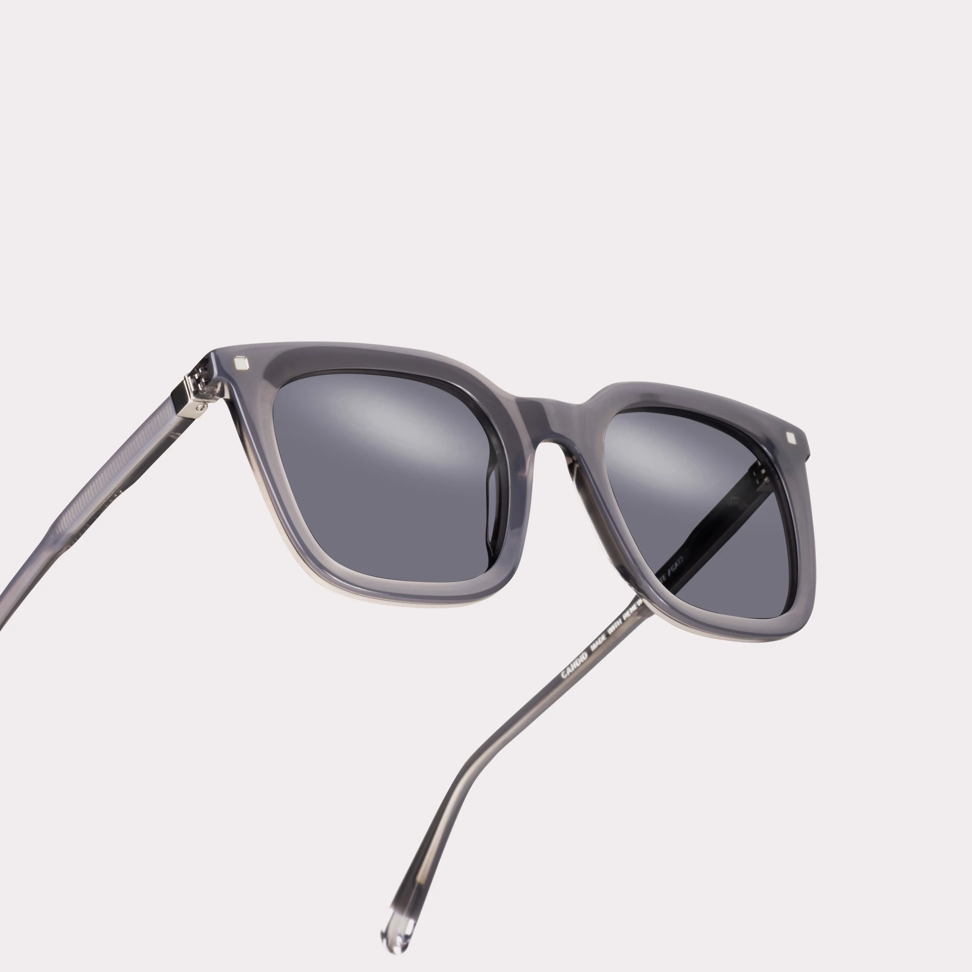 A pair of Candid Light grey Sunglasses in a macro view