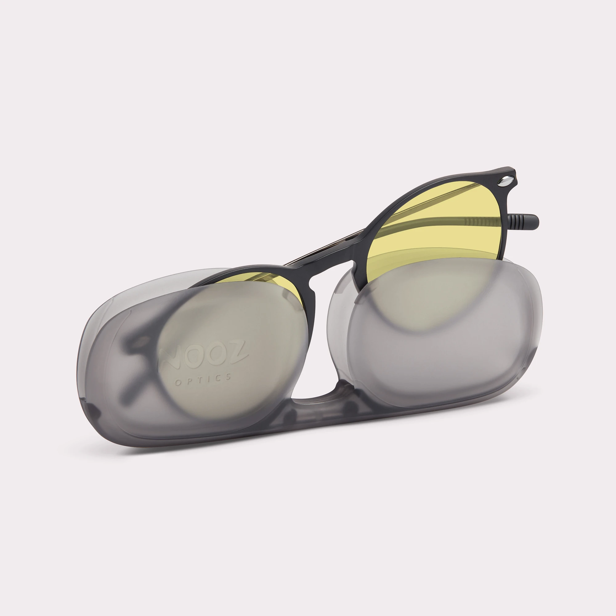A pair of Cruz Black Driving Glasses coming out of its case