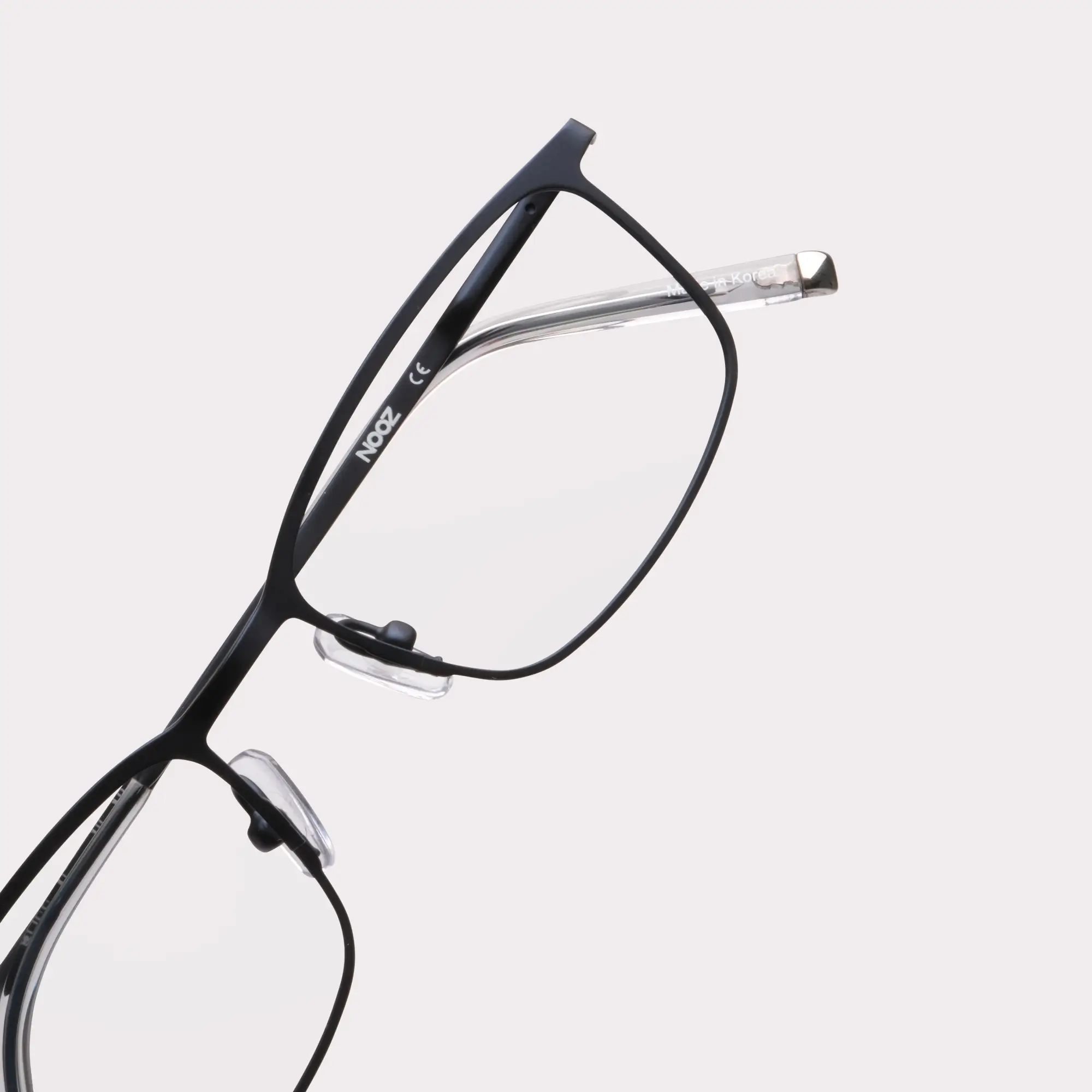 A pair of Ross Navy Prescription glasses in a macro view