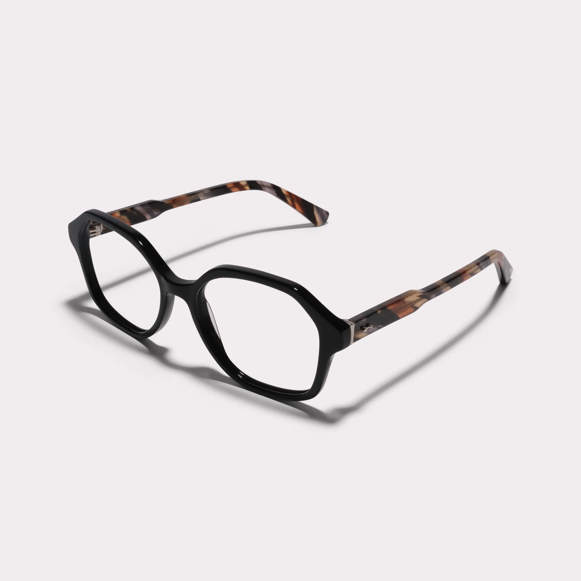 A pair of Aura Black Reading glasses seen from the side