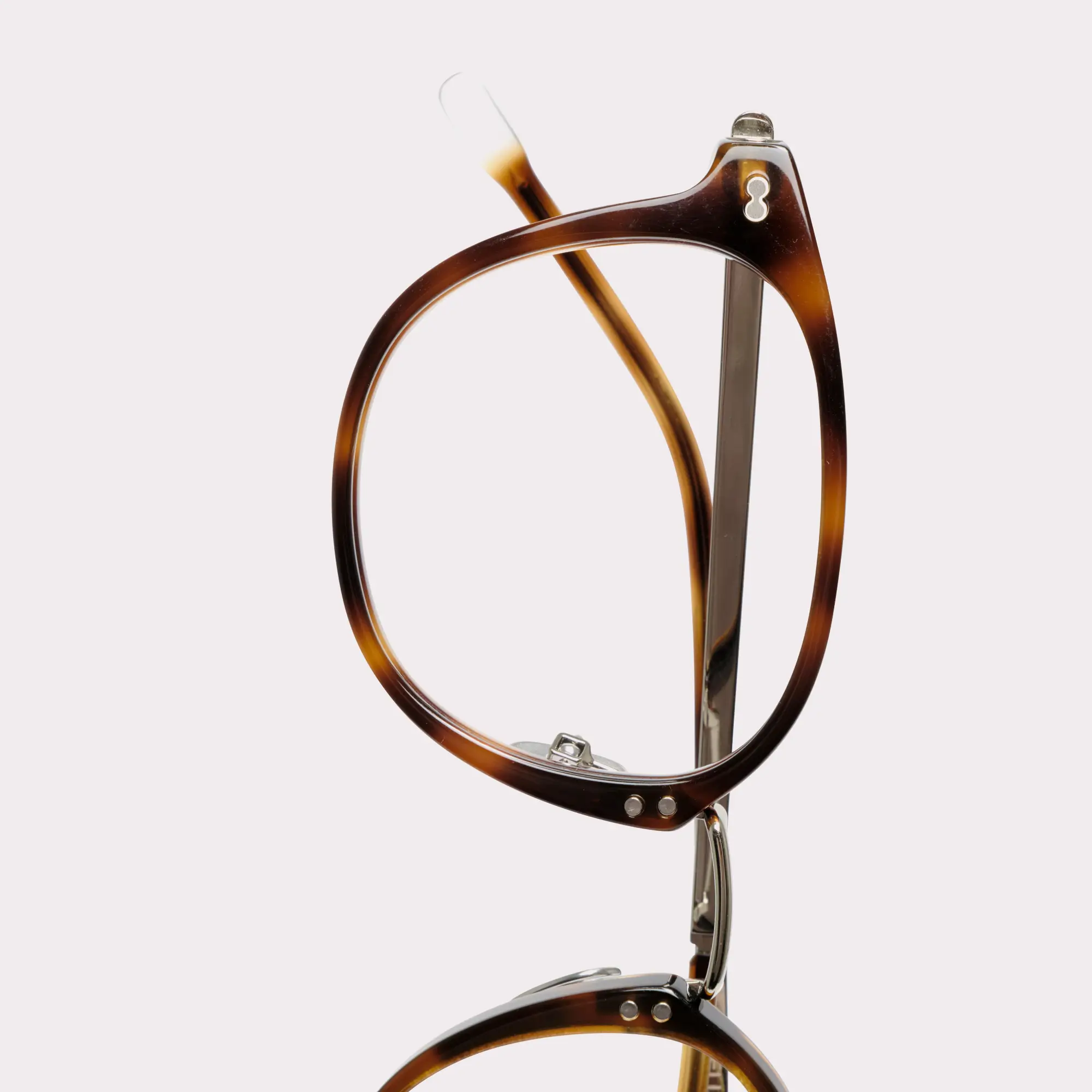 A pair of Covell Tortoise Multi-distance™ blue light blocking reading glasses in a macro view