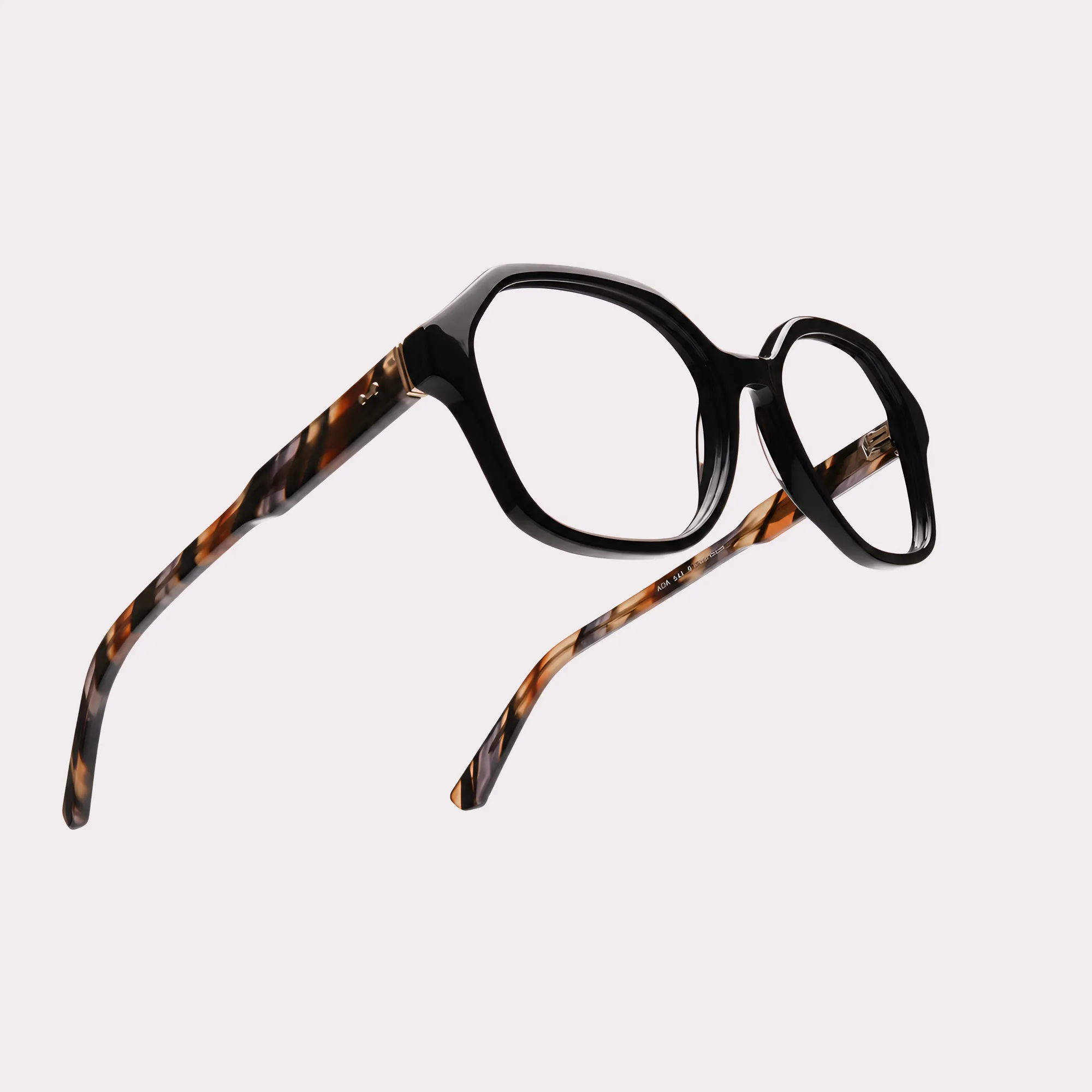 A pair of Aura Black Reading glasses in a macro view