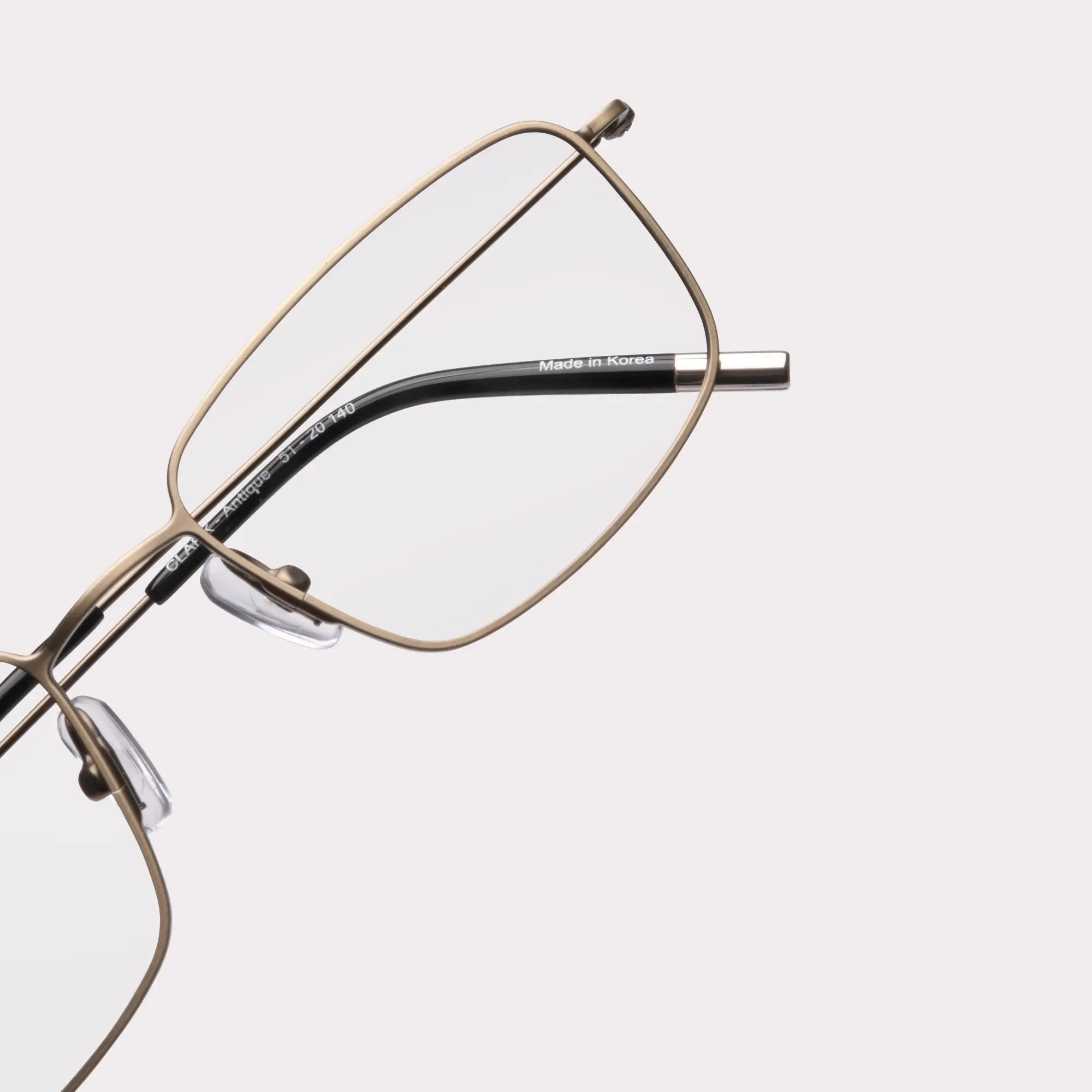 A pair of Clark Antique Multi-distance™ blue light blocking reading glasses in a macro view