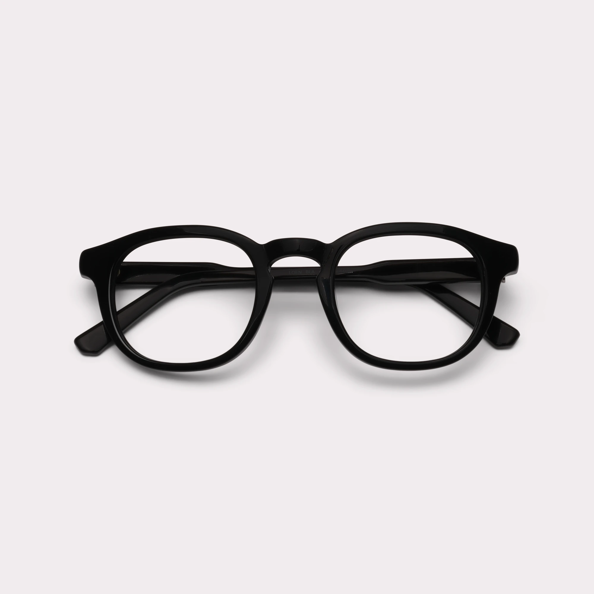 A pair of Loen Black Reading glasses folded
