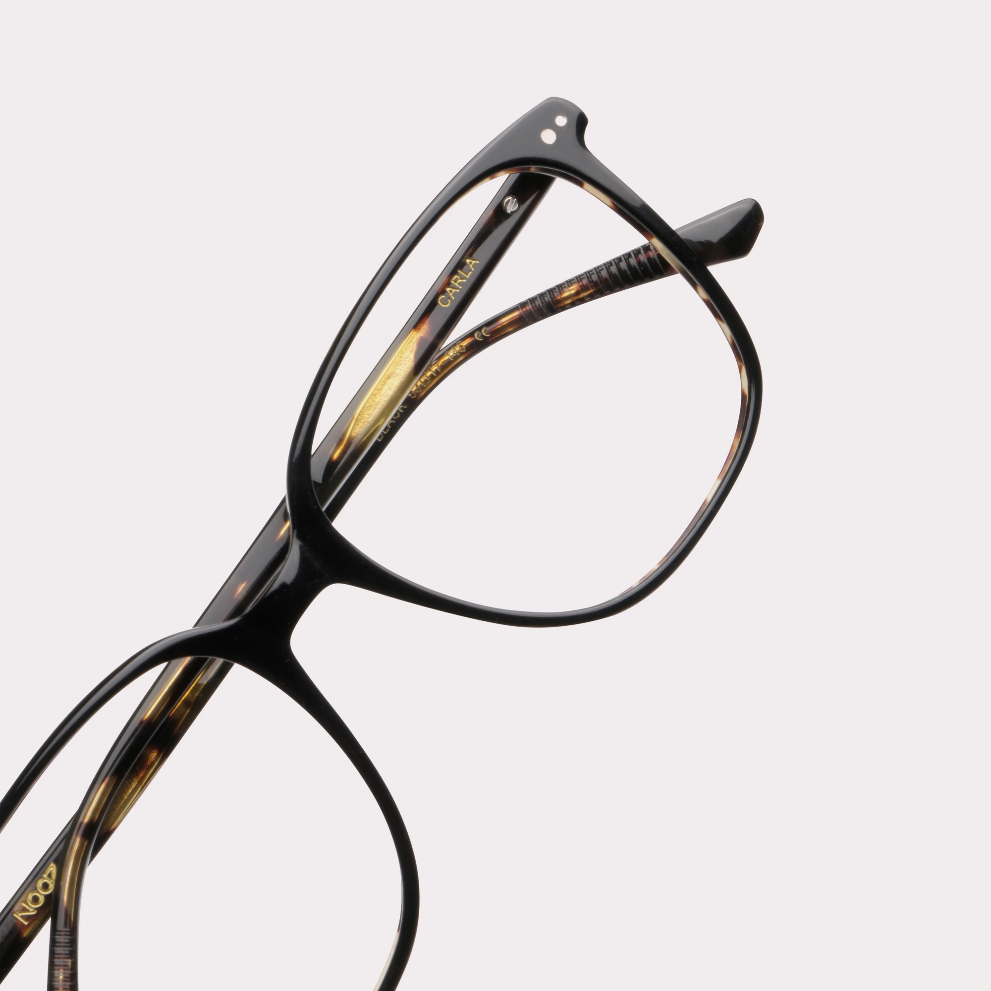 A pair of Carla Black Prescription glasses in a macro view