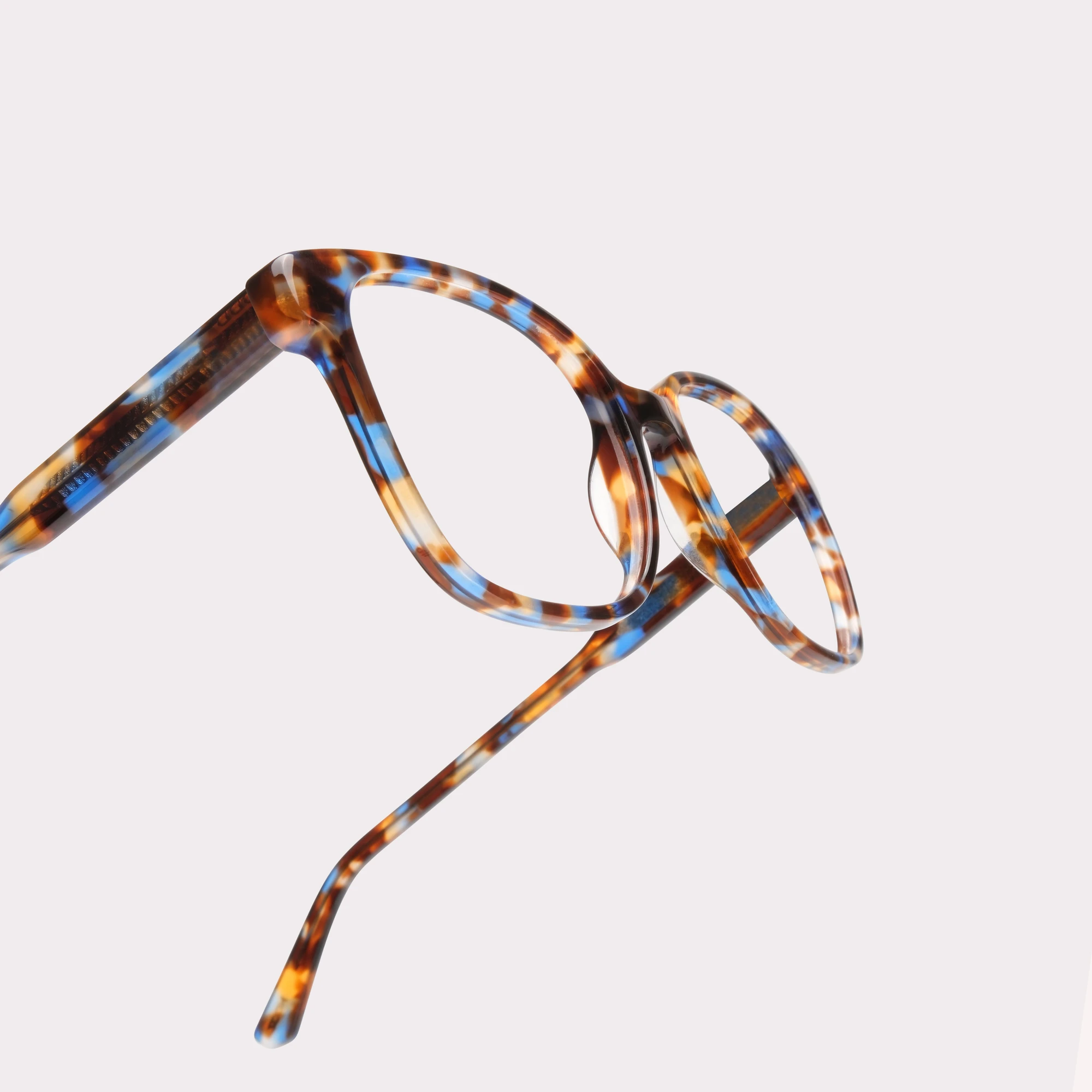 A pair of Clara Blue tortoise Multi-distance™ blue light blocking reading glasses in a macro view
