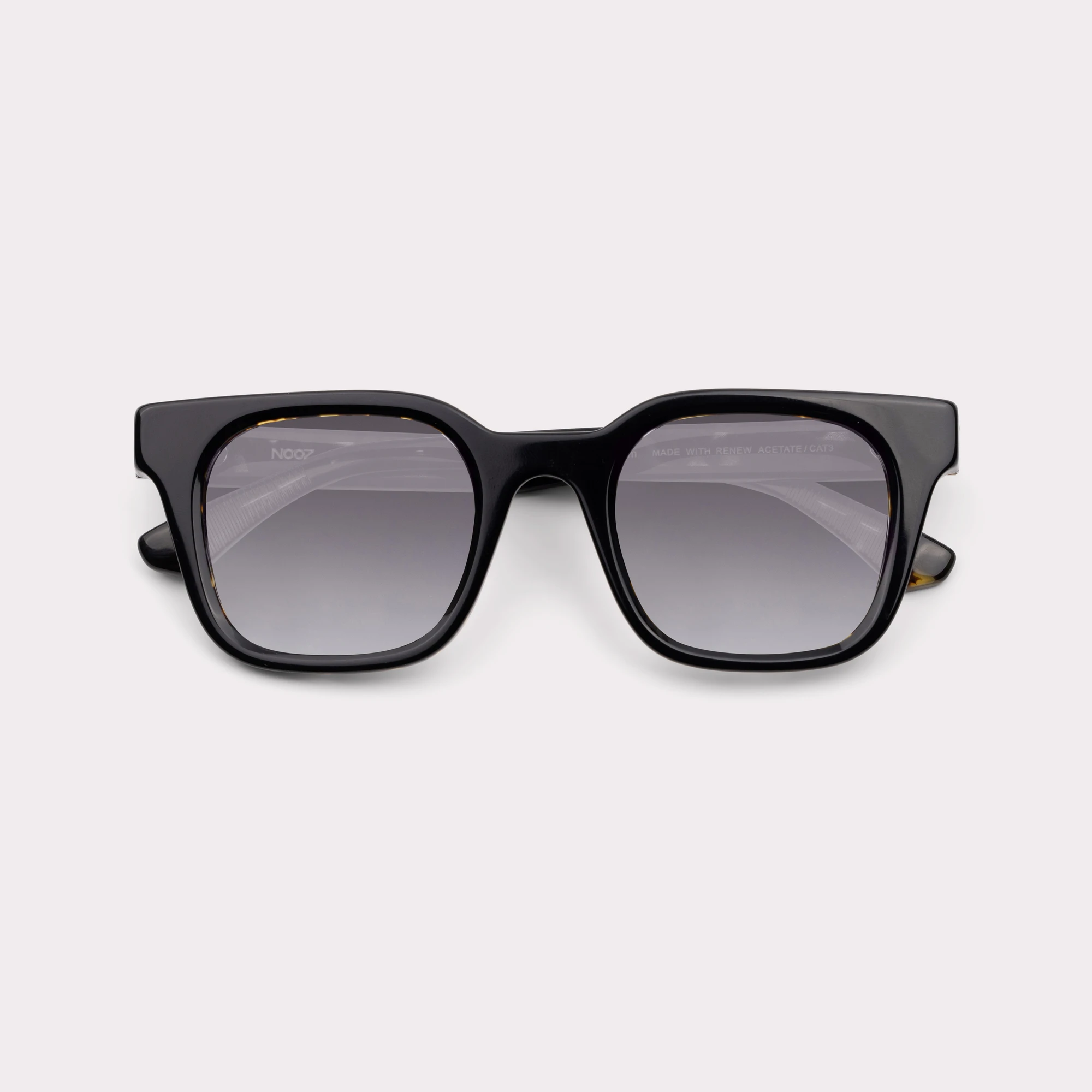 A pair of Vega Black Sunglasses folded