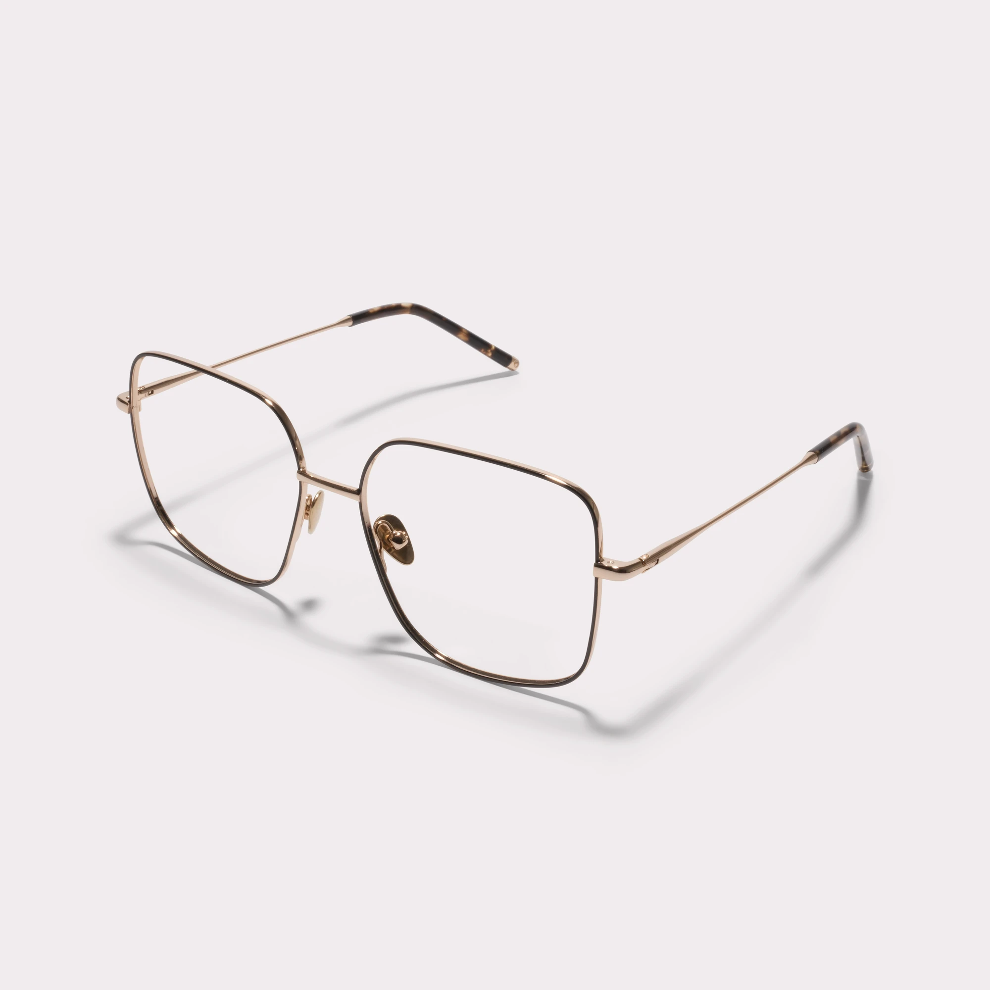 Um par de Cleo Gold Óculos graduados vista de lado