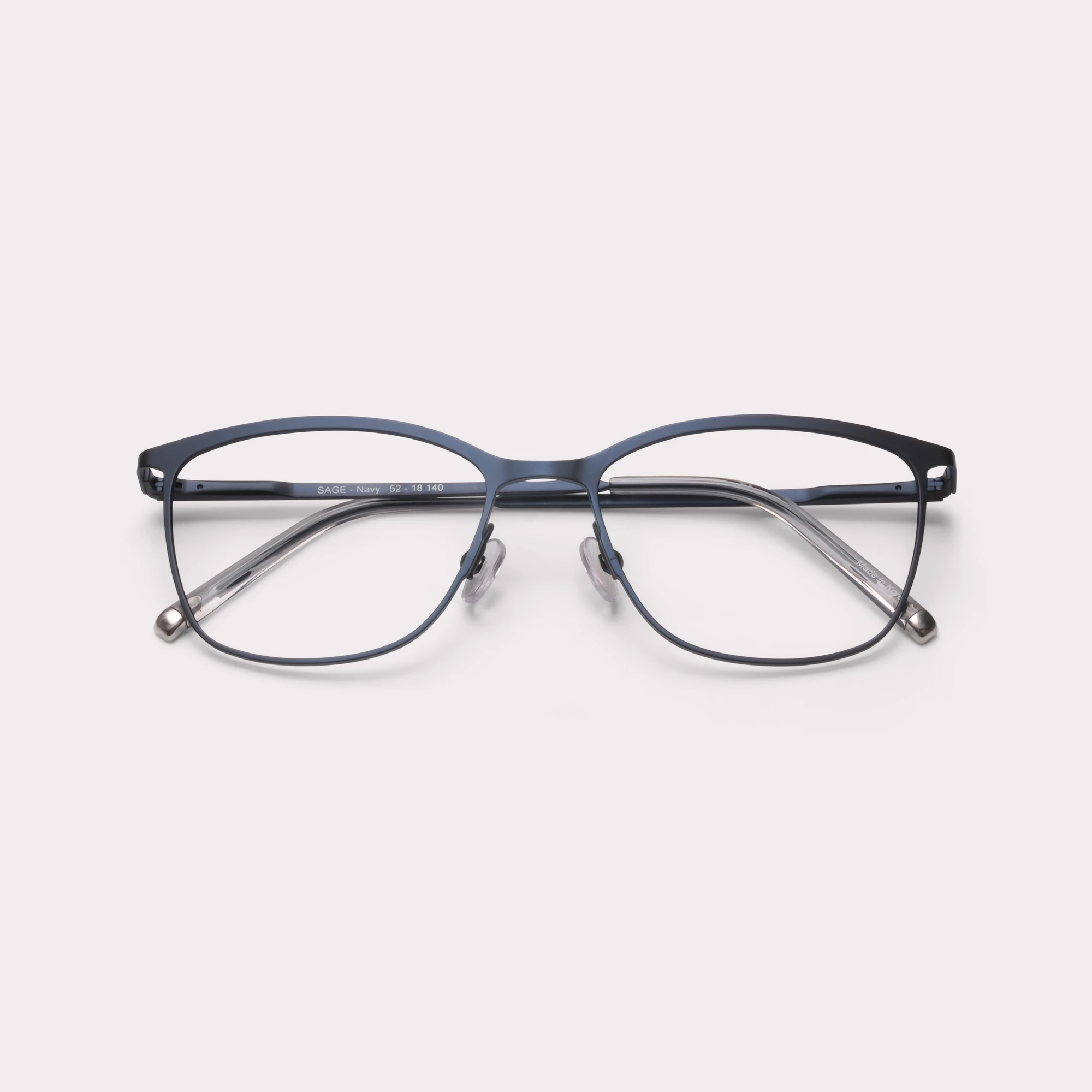 A pair of Sage Navy Prescription glasses folded