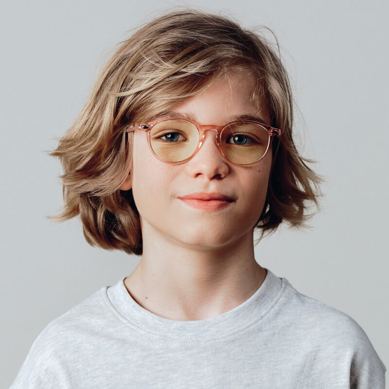 Child's blue anti-light glasses worn by a child