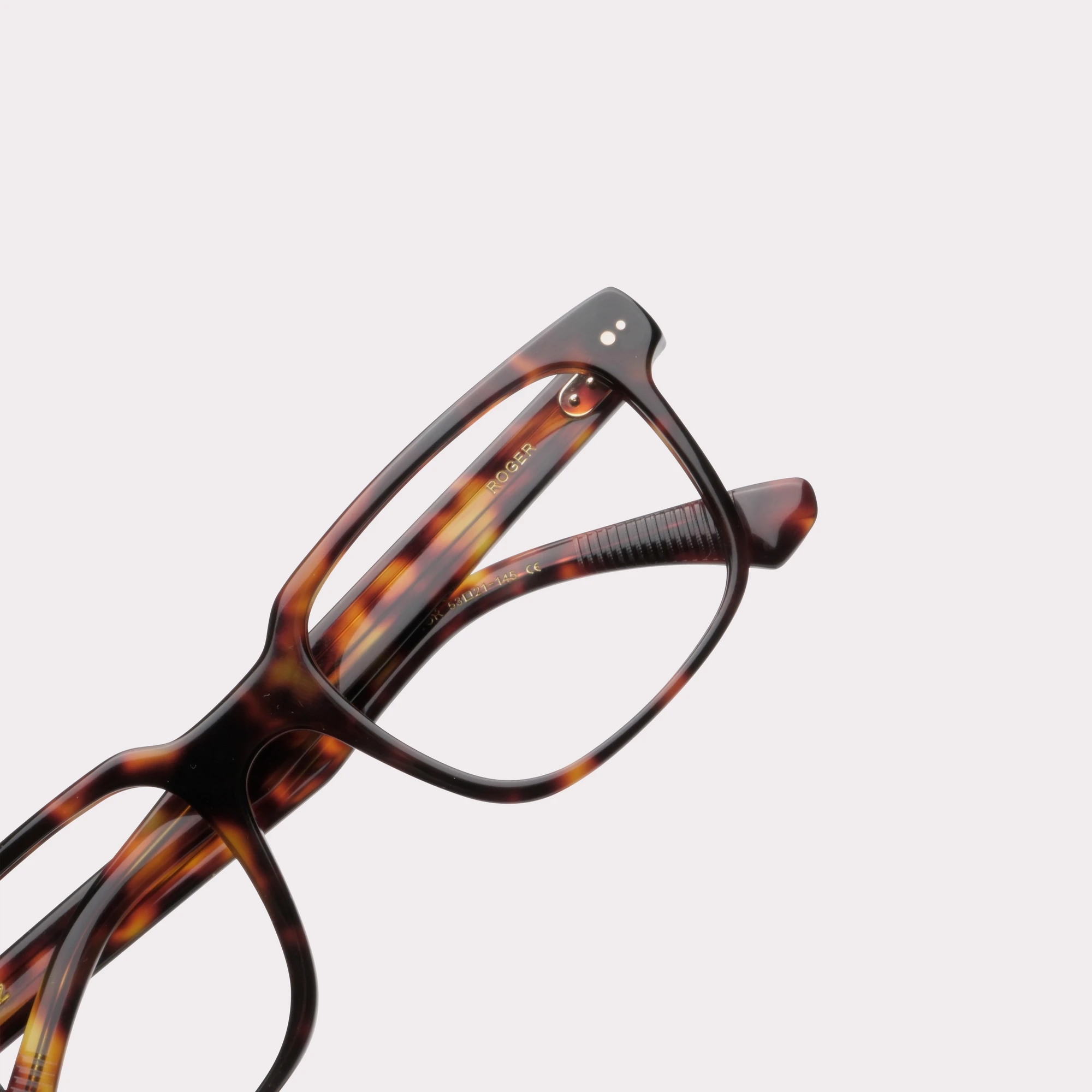 A pair of Roger Tortoise Prescription glasses in a macro view