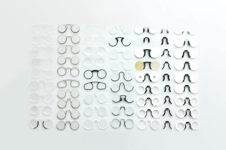 Several prototypes of glasses and transport cases