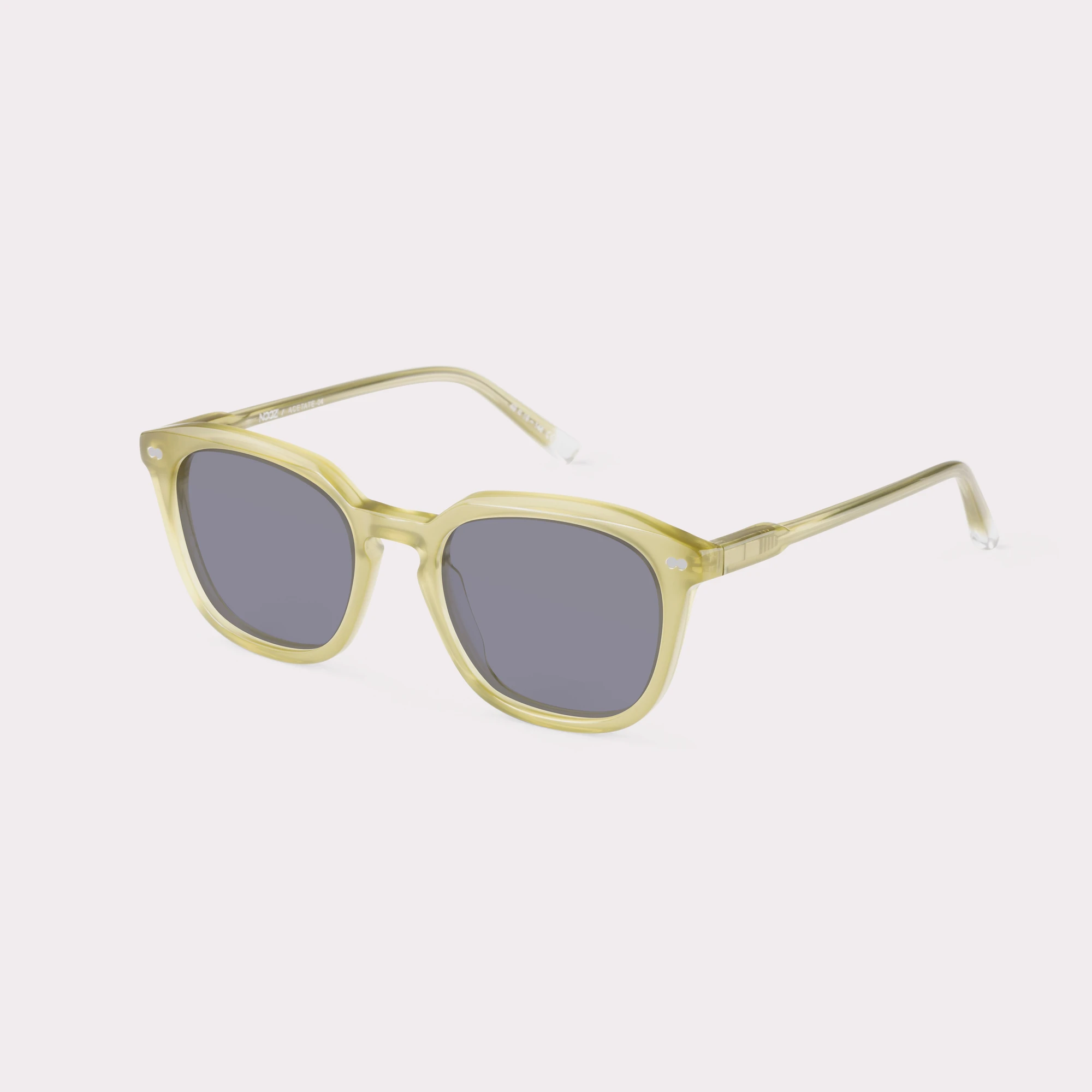 Ein Paar Clover Milky Kaki Sonnenbrille , von der Seite gesehen