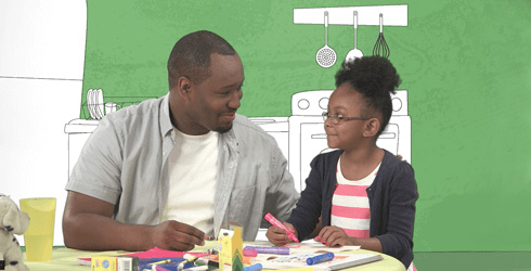 father and daughter talking in kitchen