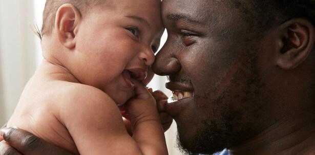 father-baby-smiling-together