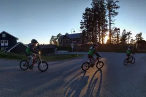 A boy on his bicycle.