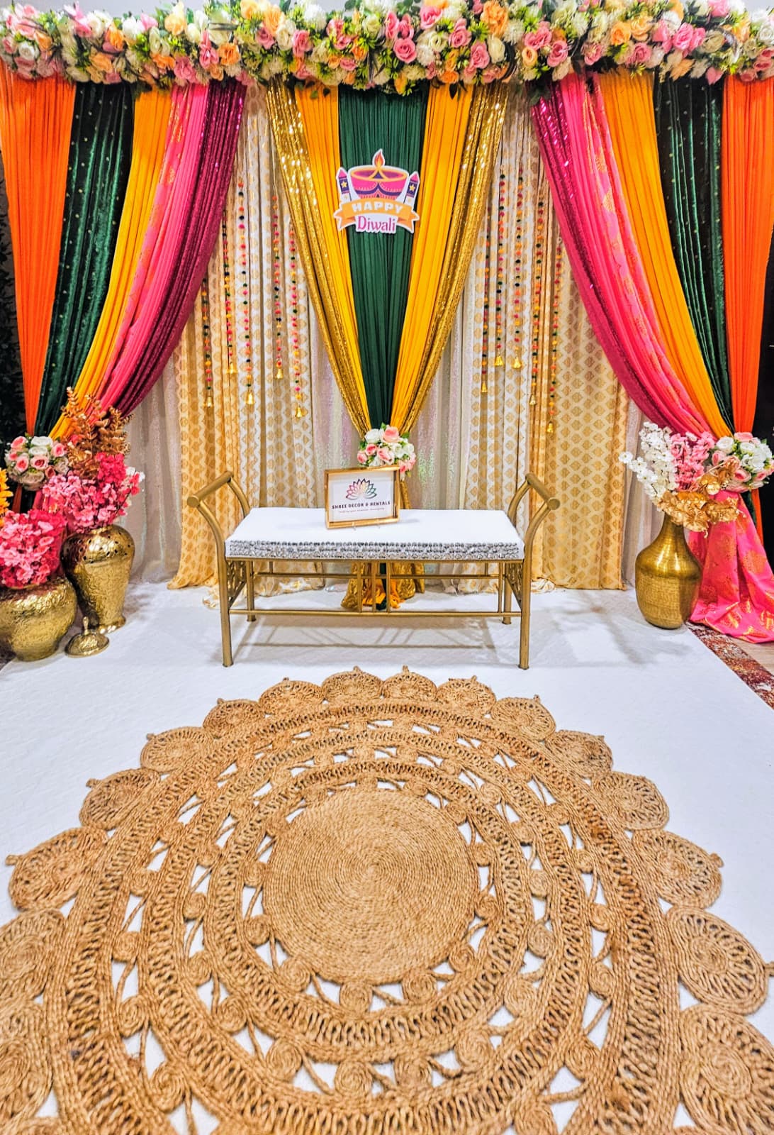 Colorful Floral Backdrop with Drapes and Gold Accents