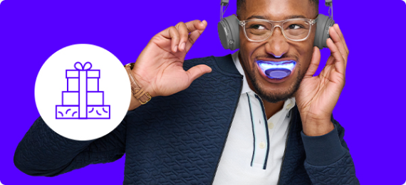 Man listening to music and dancing while using a SDC Teeth Whitening LED Light and Gift icon