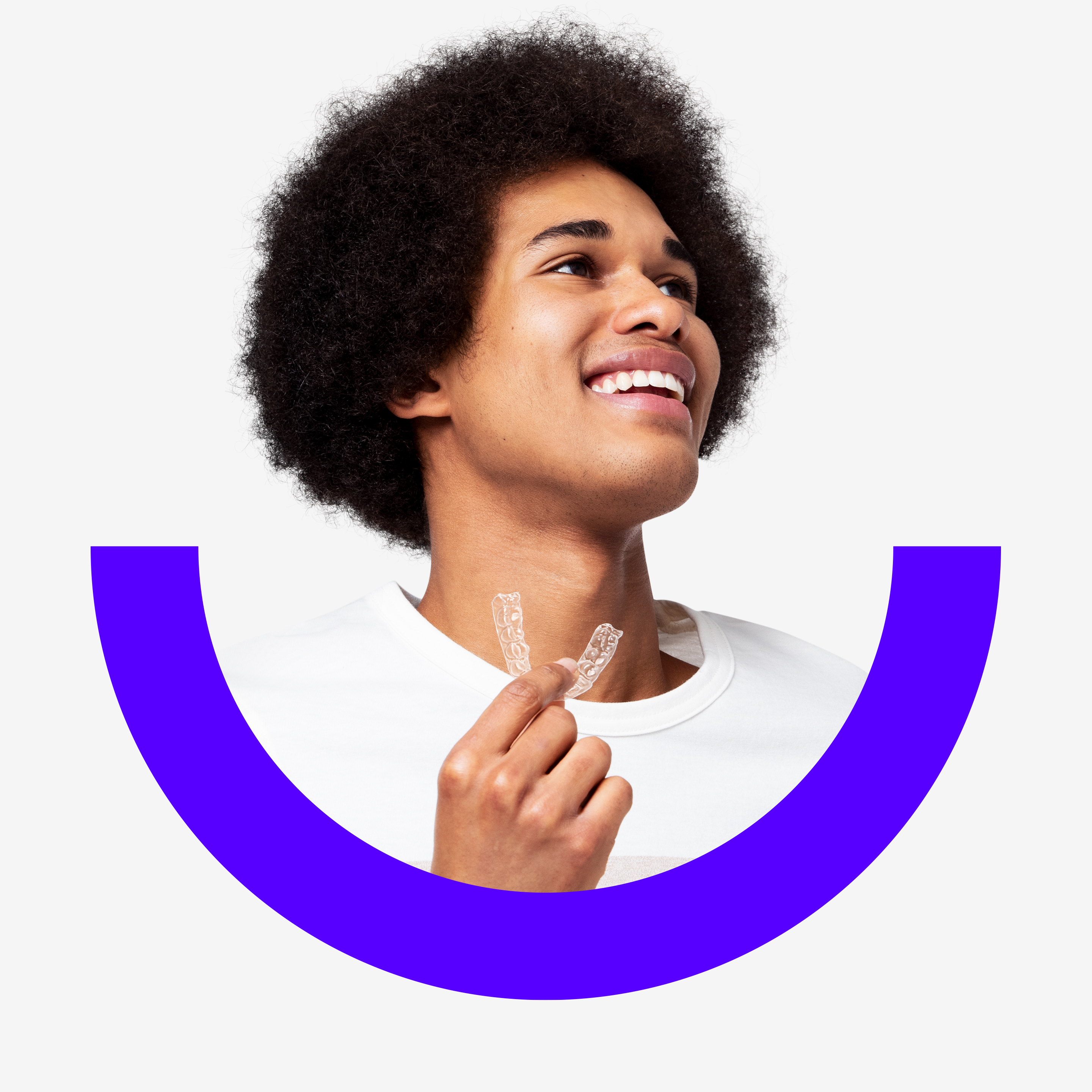 Smiling Black man holding SmileDirectClub aligner with blurple choose smile branding