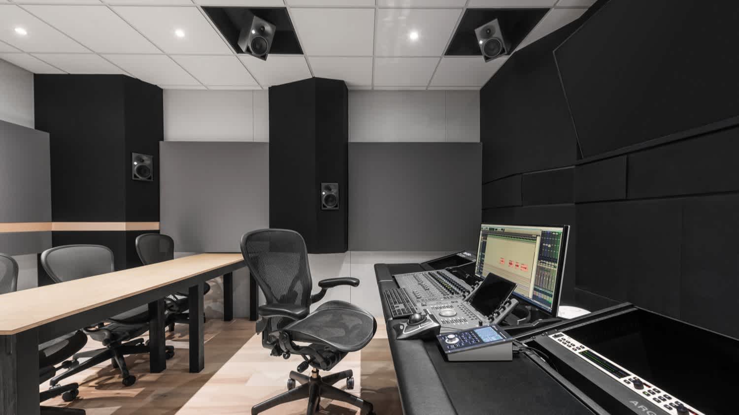 Studio A. Dolby Atmos. Chair in front of a audio console
