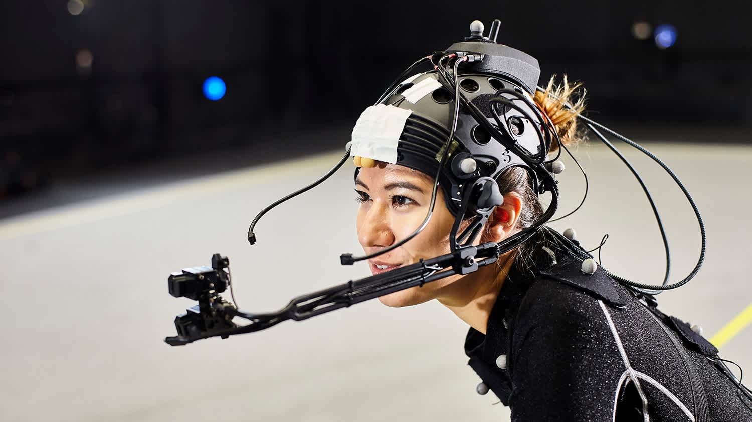 Close up on an actress with motion capture helmet doing a scene