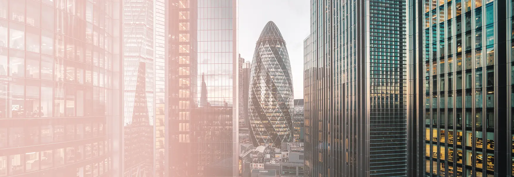 Panoramic view of the London financial district skyline featuring iconic skyscrapers, including The Gherkin, with a soft pink gradient overlay on the left side.