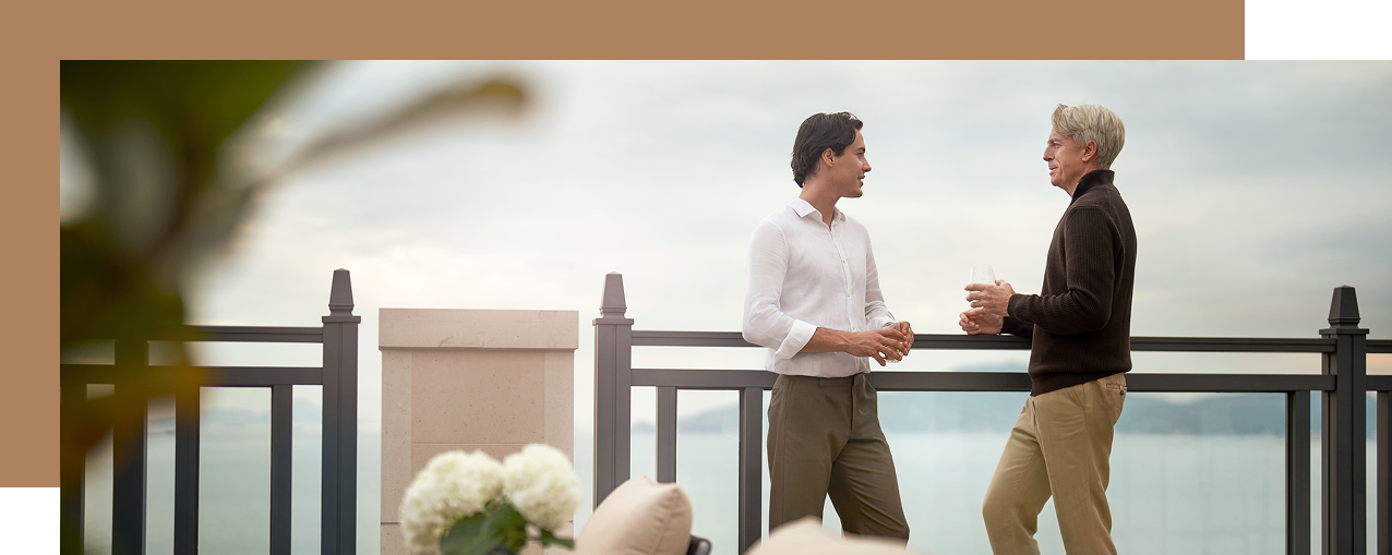 Two business professionals holding a meeting in a Hong Kong high-rise.