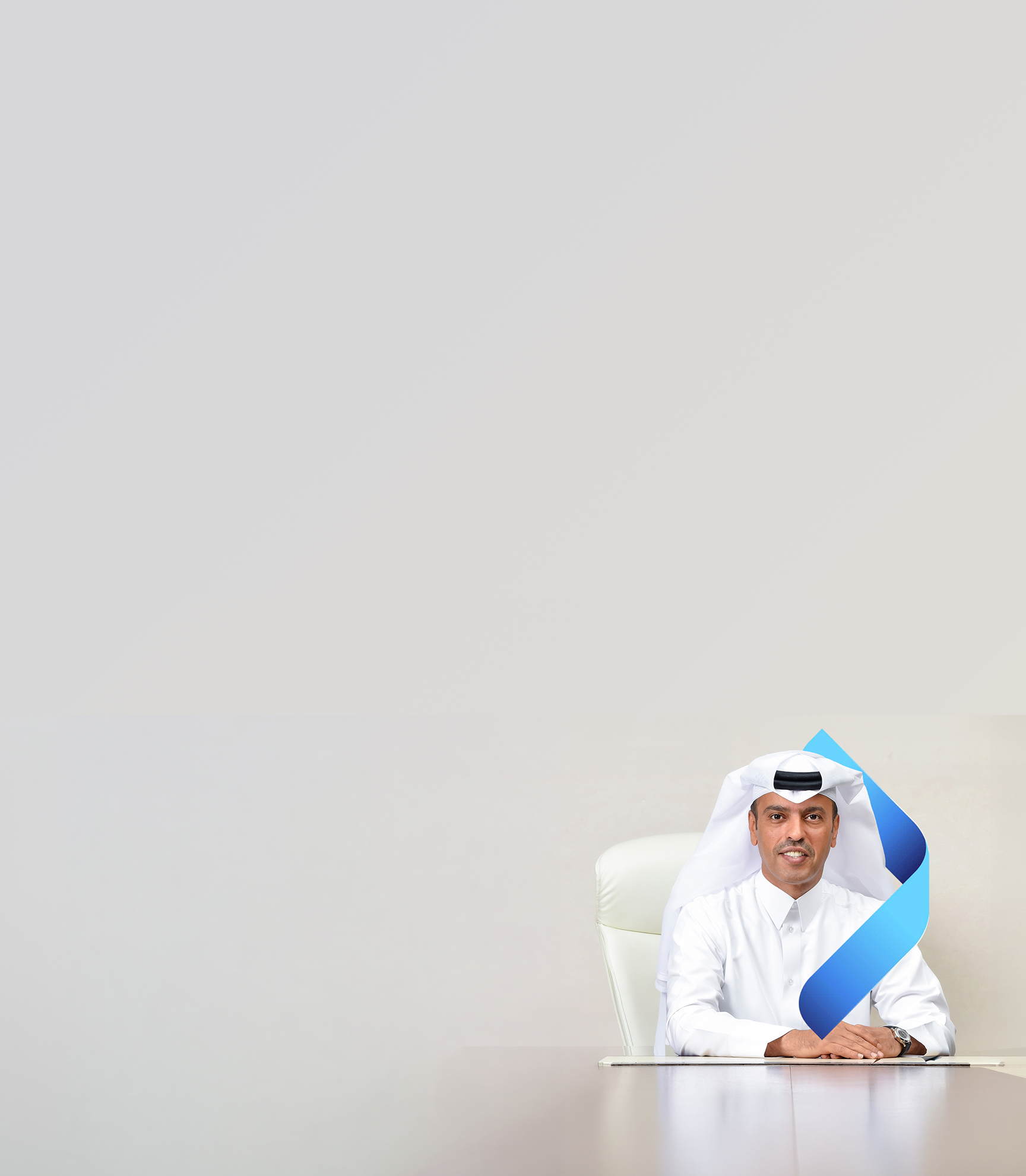 Portrait of Abdulla Mubarak Al-Khalifa, group chief executive officer, QNB Group smiling.