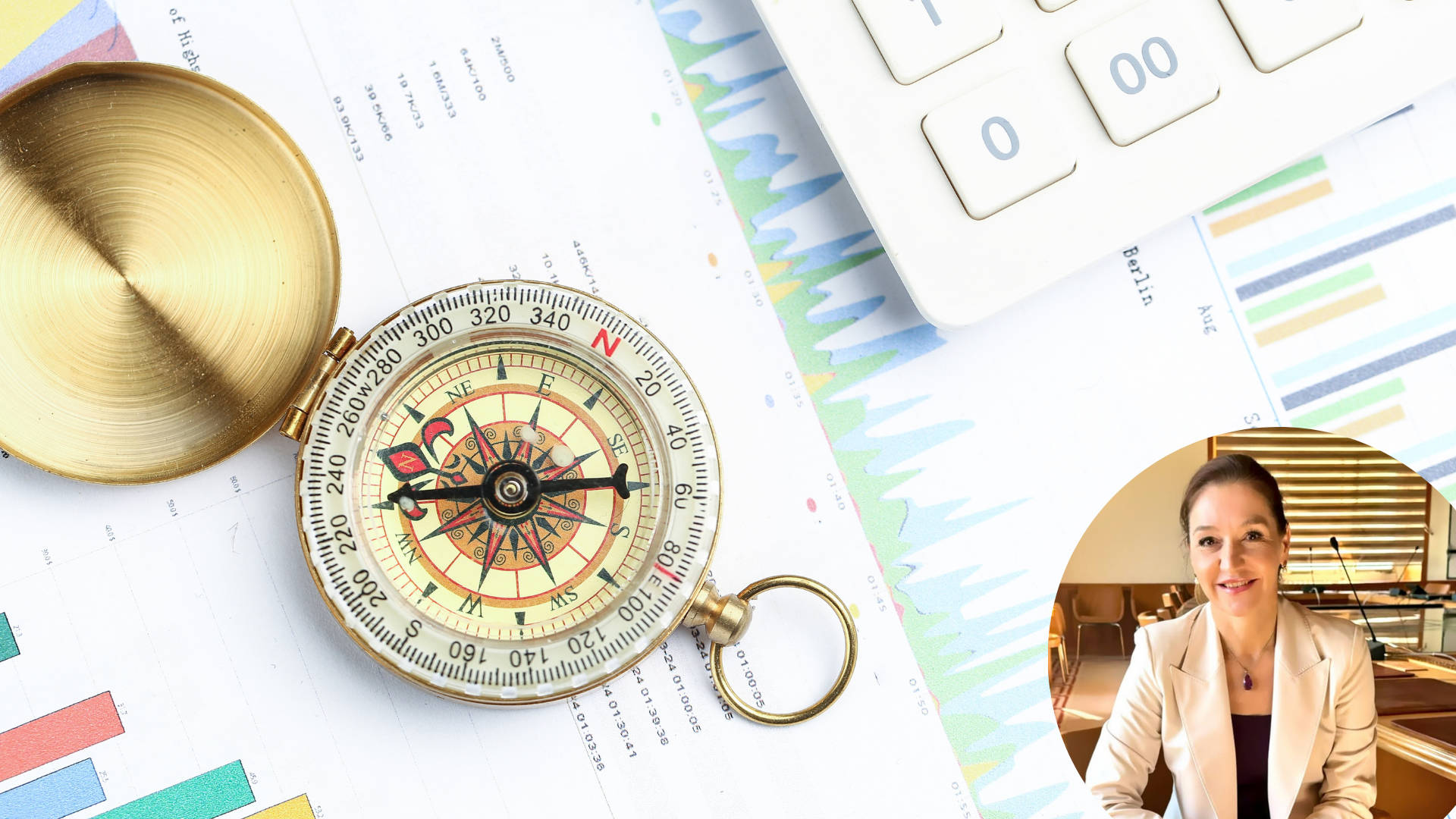 Compass is placed over statistics charts and near calculator with author photo