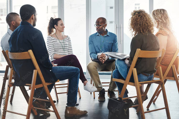 People are talking in the therapy circle