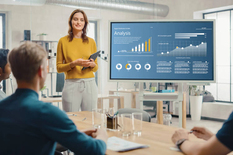 woman is showing analytics presentation