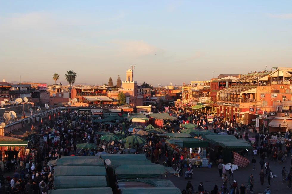 The riad views from above with lots of stalls and people. 