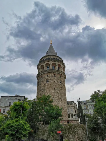 A large tower during a cloudy day, photo taken from below