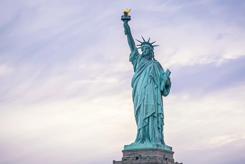 The iconic Statue of Liberty seen against cloudy skies