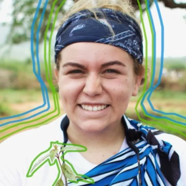 Travel advisor Erika Sobelman wears a blue bandana around her hair and a blue and white scarf around her neck