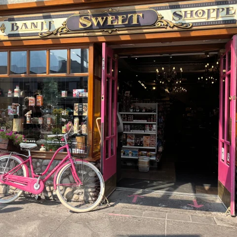 Banff Sweet Shoppe, an old fashioned candy store in Banff with a pink bicycle outside