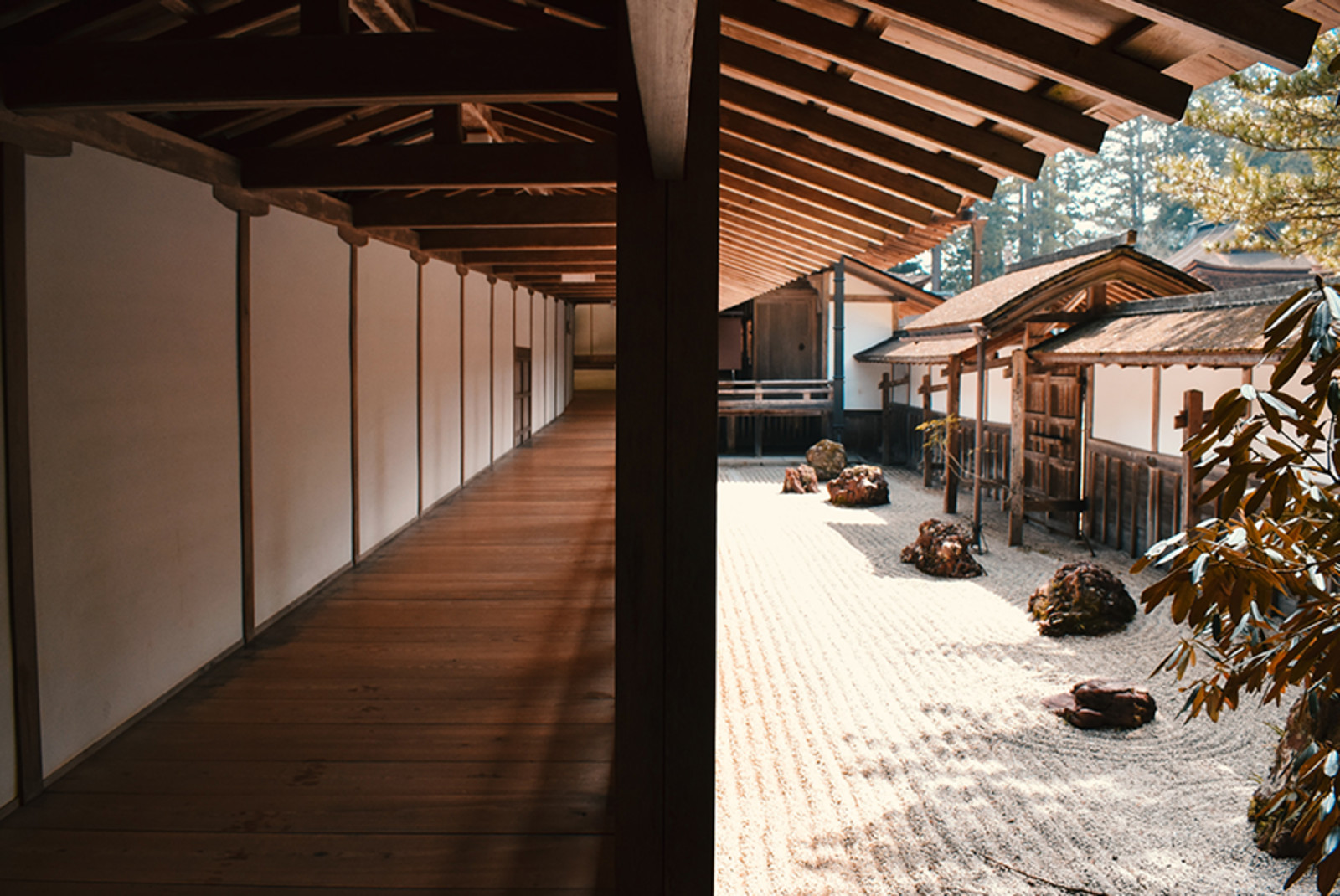Japanese zen garden with white walls and wooden floors