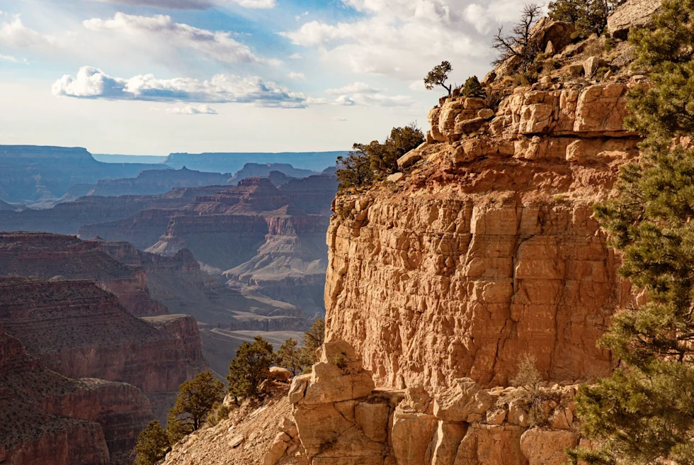 Multiple shades of orange on rocky mountains of Grand Canyon.