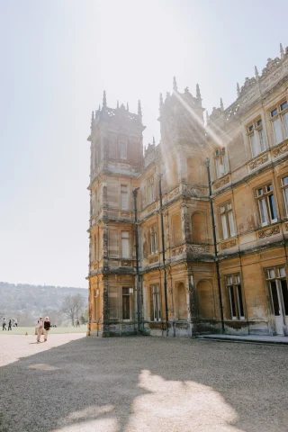 Highclere Castle is a stately English country house showcasing historical grandeur and elegance.