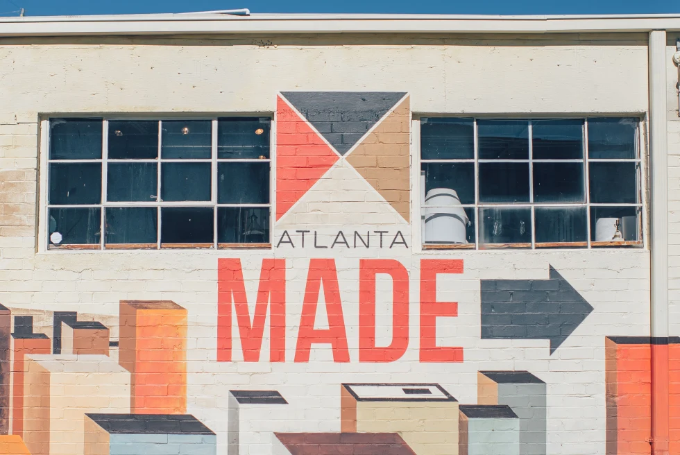 A red, brown, and black wall in downtown Atlanta, Georgia that reads "Atlanta Made".
