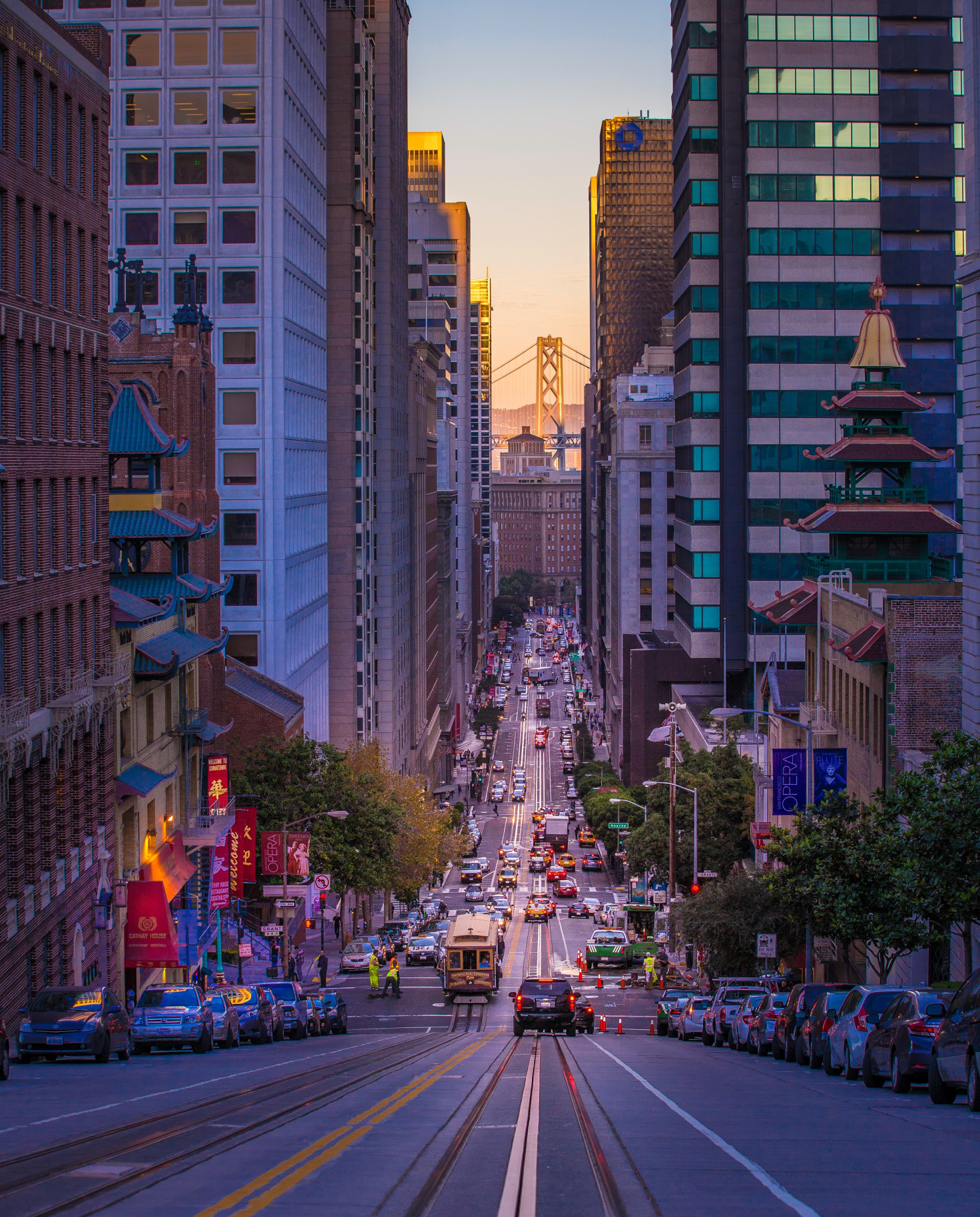 street surrounded by buildings with cars