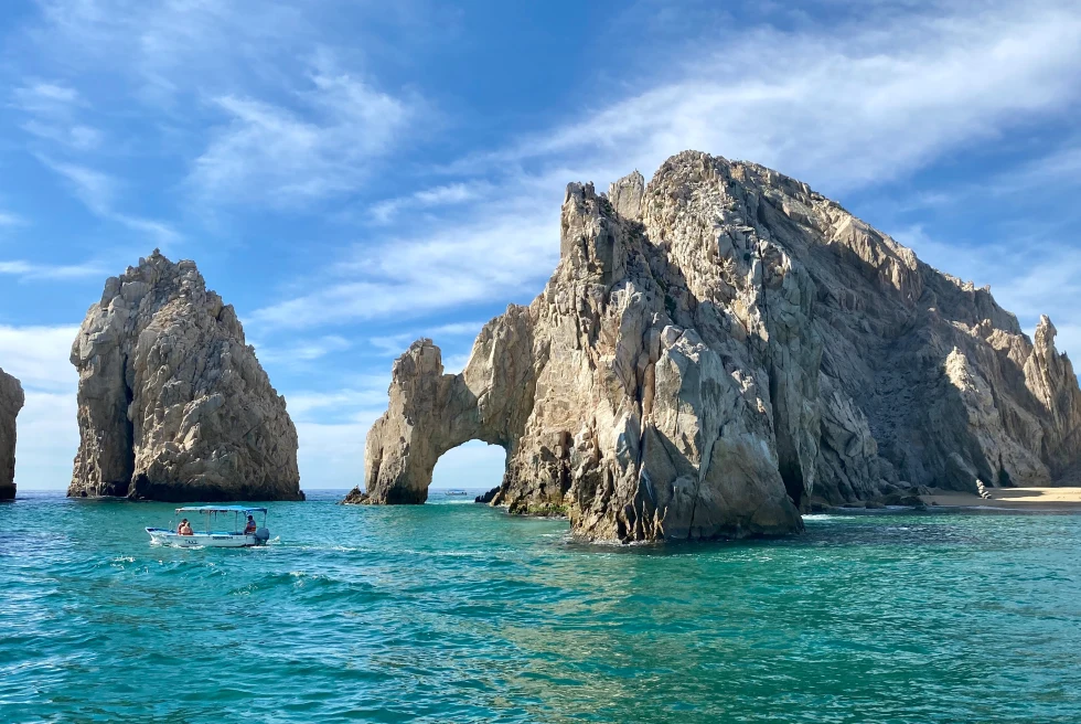 large rock in the ocean during daytime