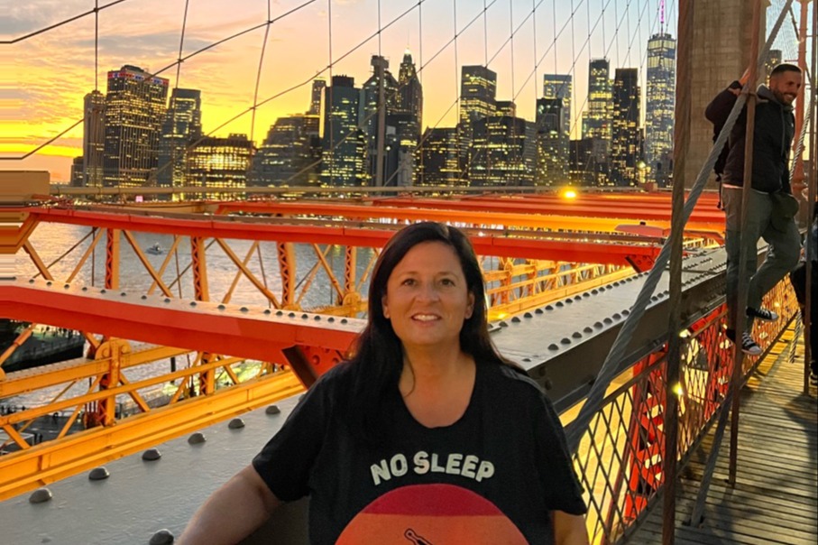 A woman on the Brooklyn Bridge. 