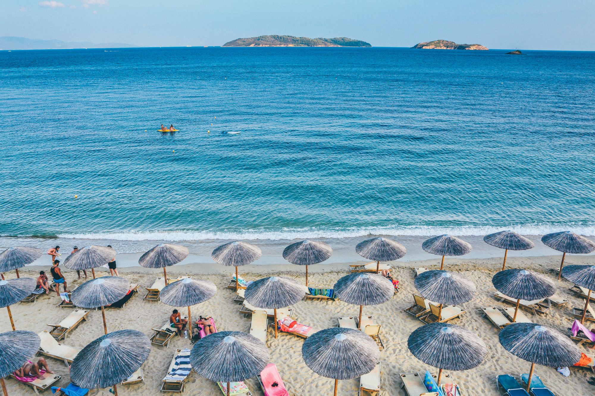 Beach with beach umbrellas and chairs.